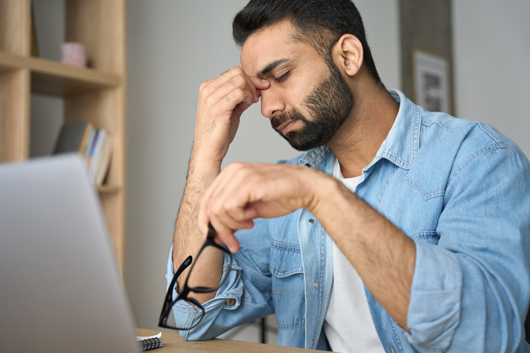 Man Removing Glasses and Relaxing His Eyes